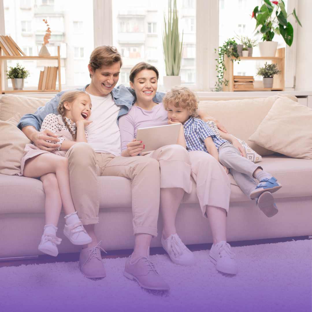 Young beautiful happy family relaxing at home